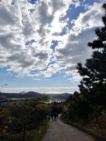 Autumn landscape with cloudy sky over the valley in the mountains.