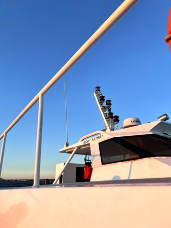 Yacht in the open sea on a sunny day, close-up
