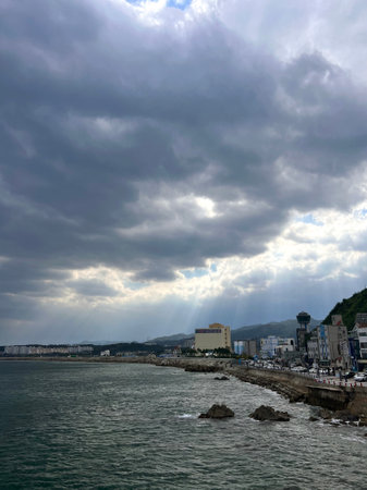 Seascape with a cloudy sky and a sea in the foregroundの写真素材