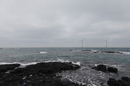 Seascape with wind turbines on the coast of the island of Lanzaroteの写真素材