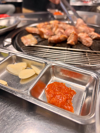 Grilled pork on the grill in the restaurant. Selective focus.の写真素材