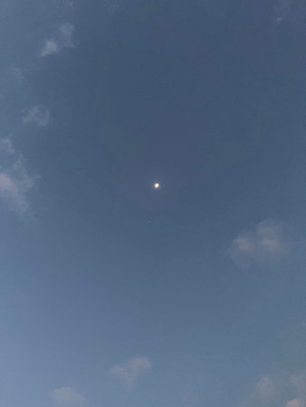 Moon and clouds in the blue sky, good for background image.