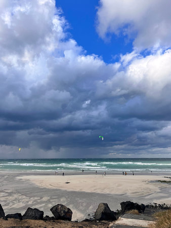 Stormy weather at the beach with a kite in the sky