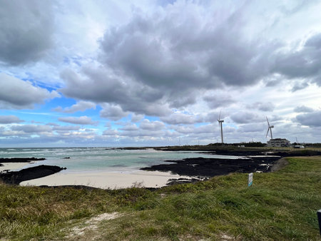 Wind turbines at the beach on the north coast of the island of Cornwall