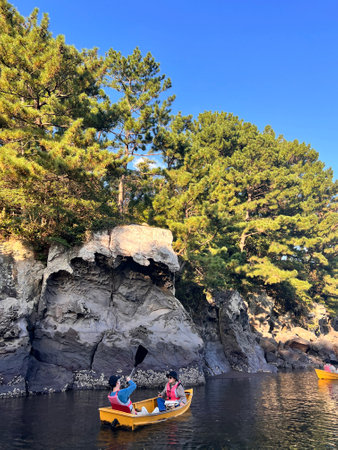 Tourists kayaking in the sea on a sunny summer day.の写真素材