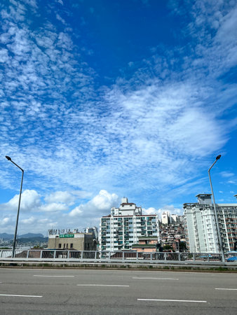 Highway in Hong Kong city with blue sky and white clouds.の写真素材