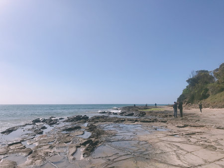 Rocky beach with blue sky and sea in the morning, Thailand