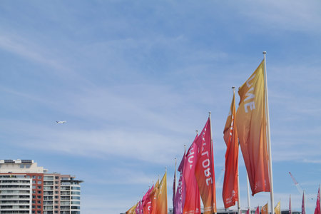 Red and yellow flags of the Republic of Thailand (ROK) on display at Bangkok International Airport.