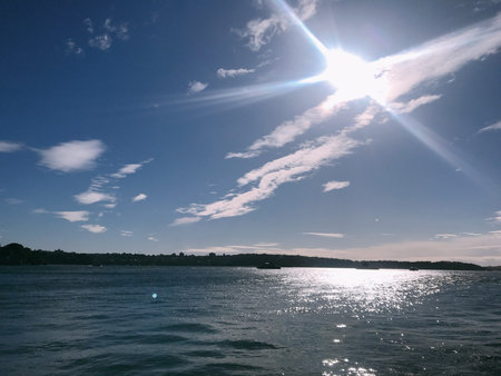 Sunset over the sea. Blue sky with white clouds. Nature composition.