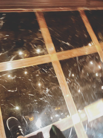 Blurred image of snow falling on the window. Winter background.