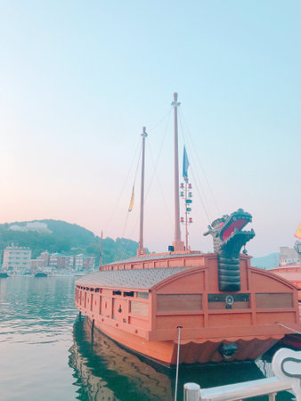Beautiful old wooden ship on the lake in the evening time.の写真素材