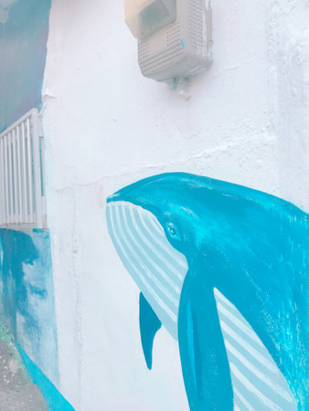 Dolphin on the wall of the building, closeup of photoの写真素材
