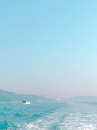 Fishing boat on the sea in the early morning. Blue sky background.