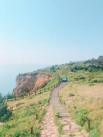 Wooden walkway on the mountain with blue sky background, Thailand.の写真素材
