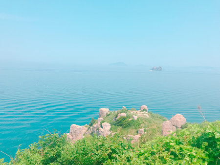 landscape of sea and mountain with blue sky background, nature seriesの写真素材