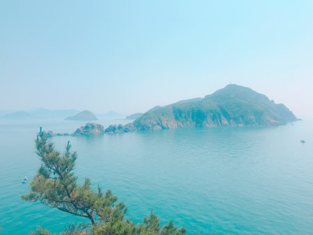 Beautiful view of sea and mountain in foggy morning, Thailand.の写真素材