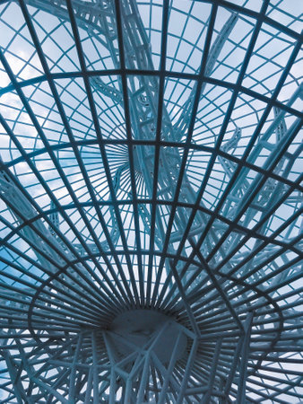 Abstract architecture background in the form of a glass dome. Blue toned.の写真素材