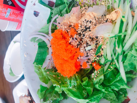Seaweed salad with salmon, seaweed, sesame seeds and vegetables