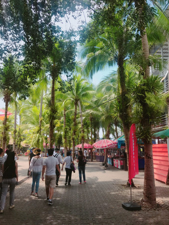 Unidentified tourists walk along the street in Kuala Lumpur, Malaysia.の写真素材