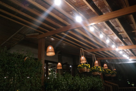 Wooden ceiling decorated with chandeliers and flowers, Thailand.の写真素材