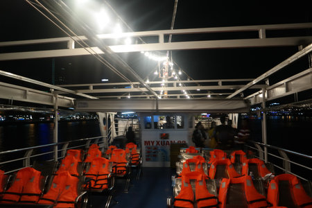 Life jackets on the deck of a cruise ship in the night.