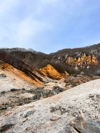 Landscape view of open pit mine, with blue sky background.の写真素材