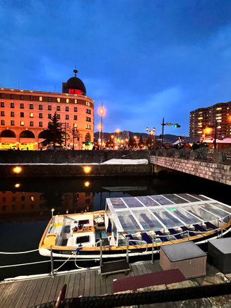 Boat on the quay at night in Bilbao, Spainの写真素材