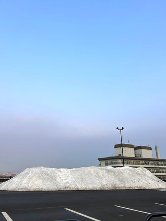 piles of snow on the roof of a building, closeup of photo