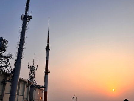 Silhouette of TV tower in the city with sunset sky backgroundの写真素材