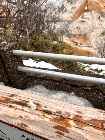Wooden bench in the park in winter, closeup of photoの写真素材