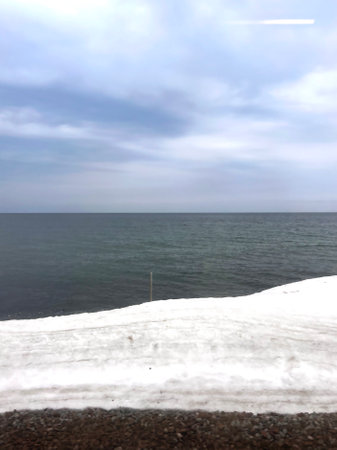 Snow on the shore of the Black Sea in the early spring.の写真素材