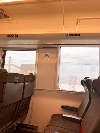 Interior of a train with seats and window seat in the cabinの写真素材