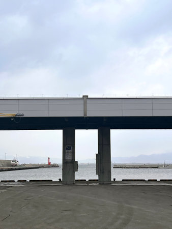bridge over the sea in a cloudy day, closeup of photoの写真素材