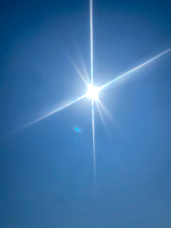 sunlight in the blue sky, closeup photo with shallow DOFの写真素材