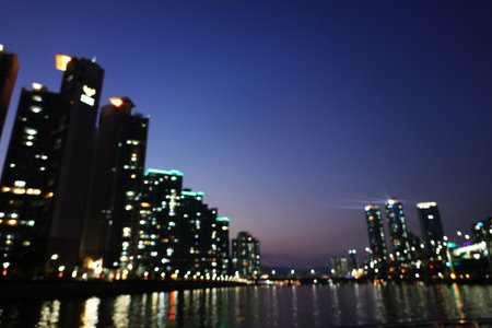 City at night, Blurred bokeh of building background.の写真素材