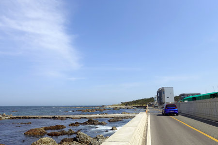 Coastal road with blue sky and white cloud in Thailand.の写真素材