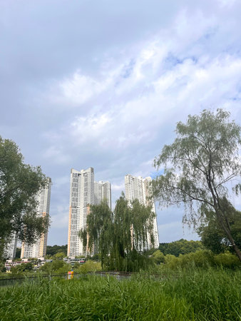 High rise residential building in the park, closeup of photo.