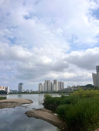 Scenery of the park and the river under the blue sky.