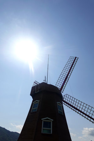 windmill in the blue sky, photo as a background, digital imageの写真素材