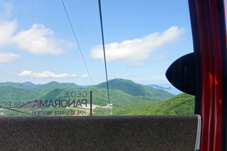 Mountain view from the window of a red car in Hong Kongの写真素材