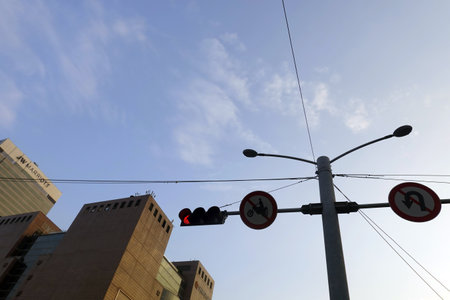 Traffic lights and buildings in the city, closeup of photoの写真素材