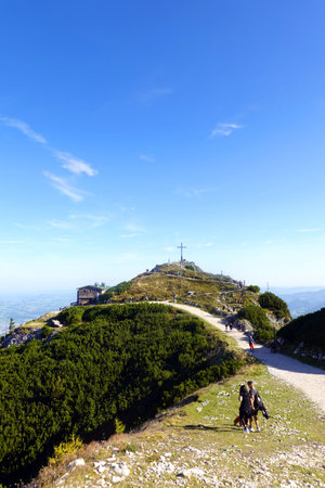 Climbing on the top of the mountain with a view of the skyの写真素材