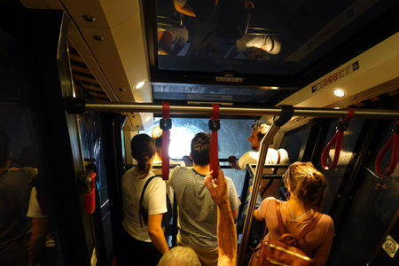 Unidentified people traveling by train in Bangkok, Thailand.の写真素材
