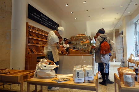 People visit the famous Montblanc bakery in Barcelona, Spain. Montblanc is one of the oldest bakery...