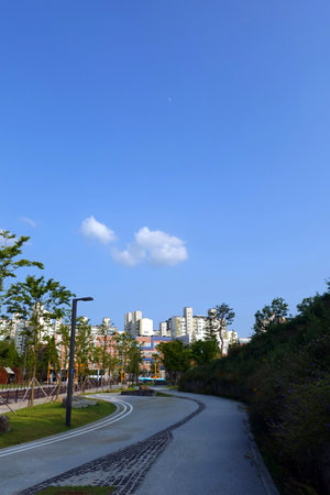 city landscape under the blue sky and white clouds, closeup of photoの写真素材