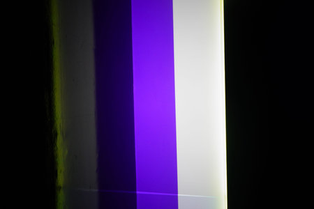Colorful neon lines in a dark room, closeup of photo