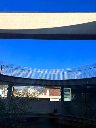 View from the bottom of a modern building on a sunny day.