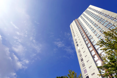 Modern high-rise building against the blue sky. Facade of a modern building
