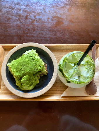 Green tea ice cream and matcha green tea cake on wooden table