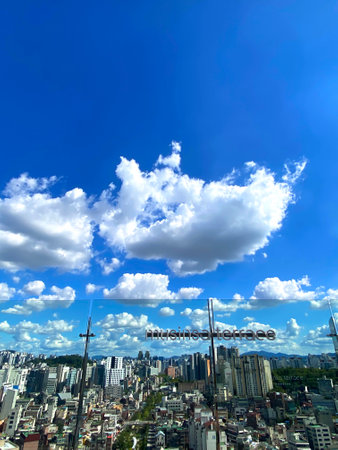 Clouds in the blue sky over the city of Seoul, South Koreaの写真素材